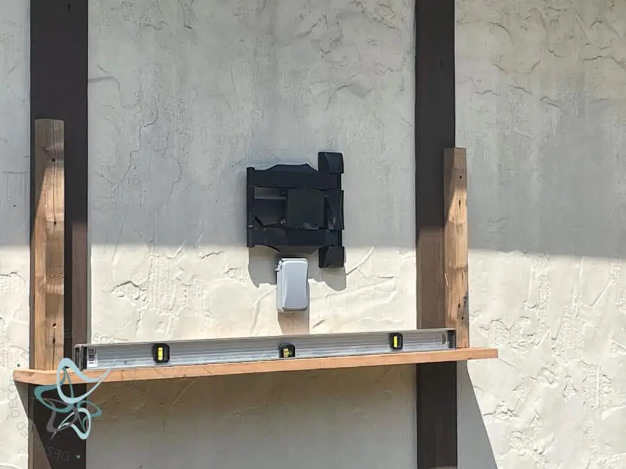 building an outdoor tv cabinet on the side of a garage.