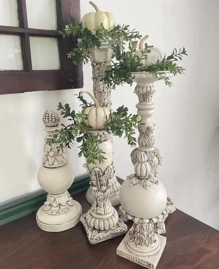 cream painted candlestick holders