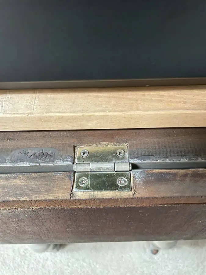 close up of the hinges for the drop down drawer