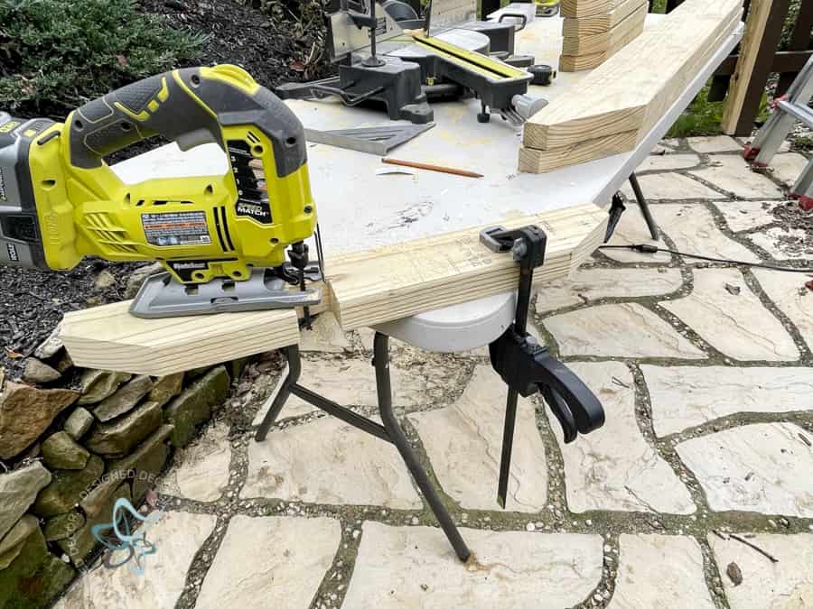 using a jigsaw to make cuts on a 2x4