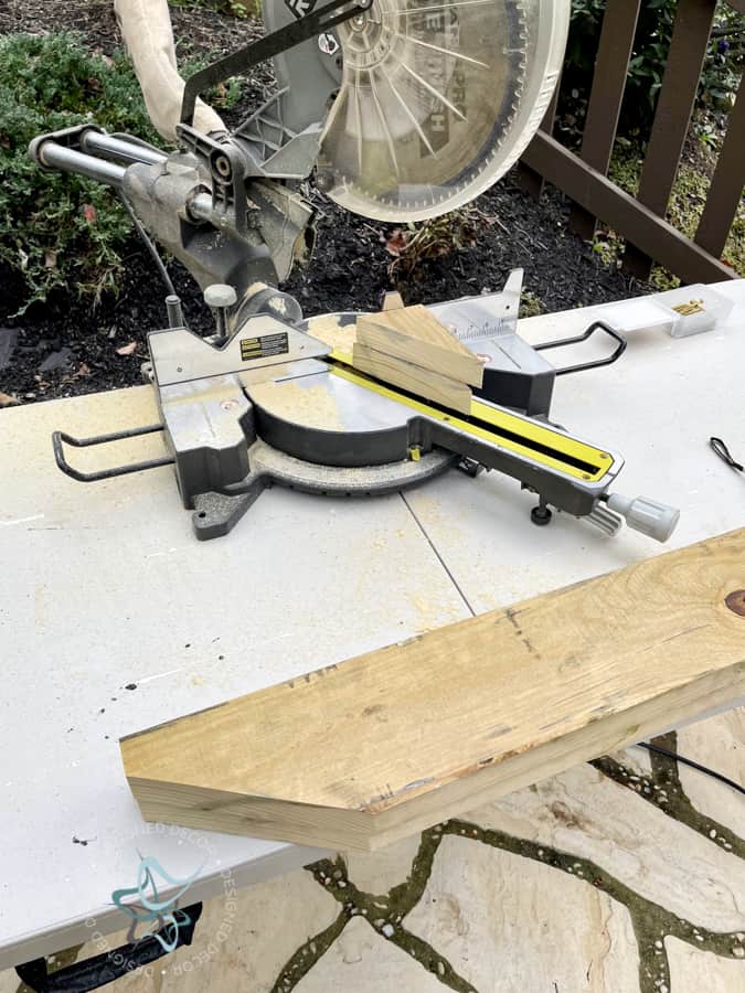 cutting a 2 x 4 with a chop saw