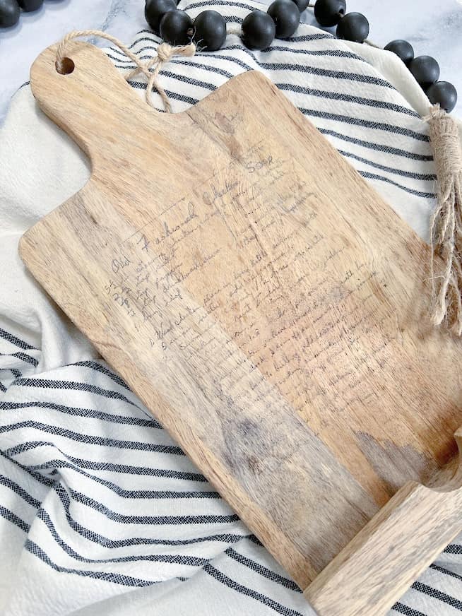 handwritten recipe image transferred on to an old cutting board