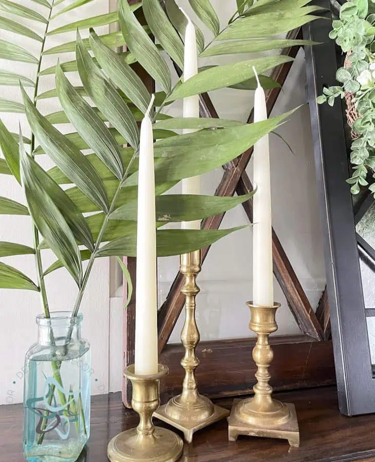 Spring Mantel with palm leaves and candle sticks