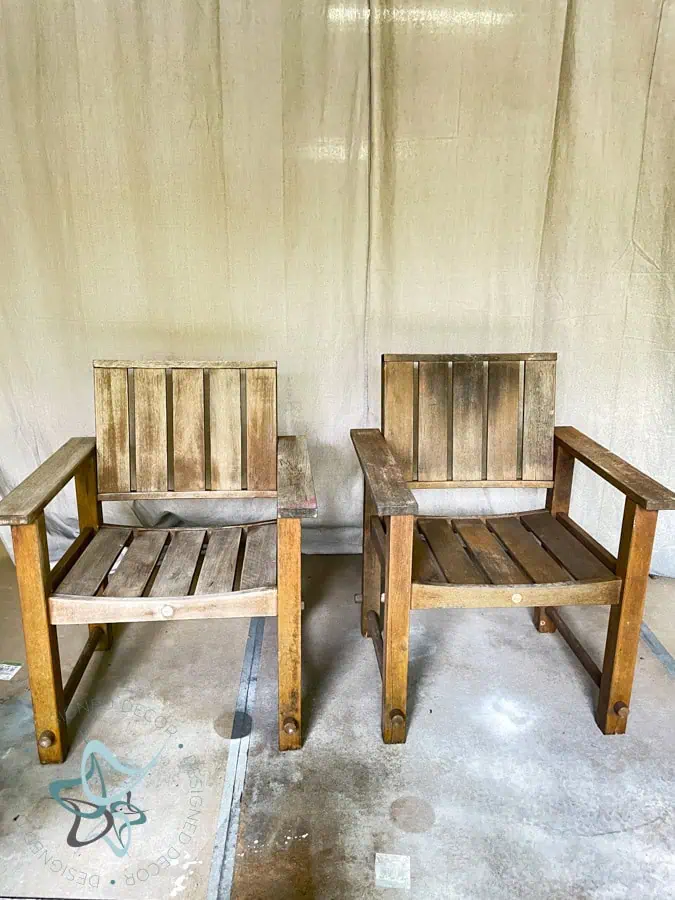 Faded outdoor wood arm chairs