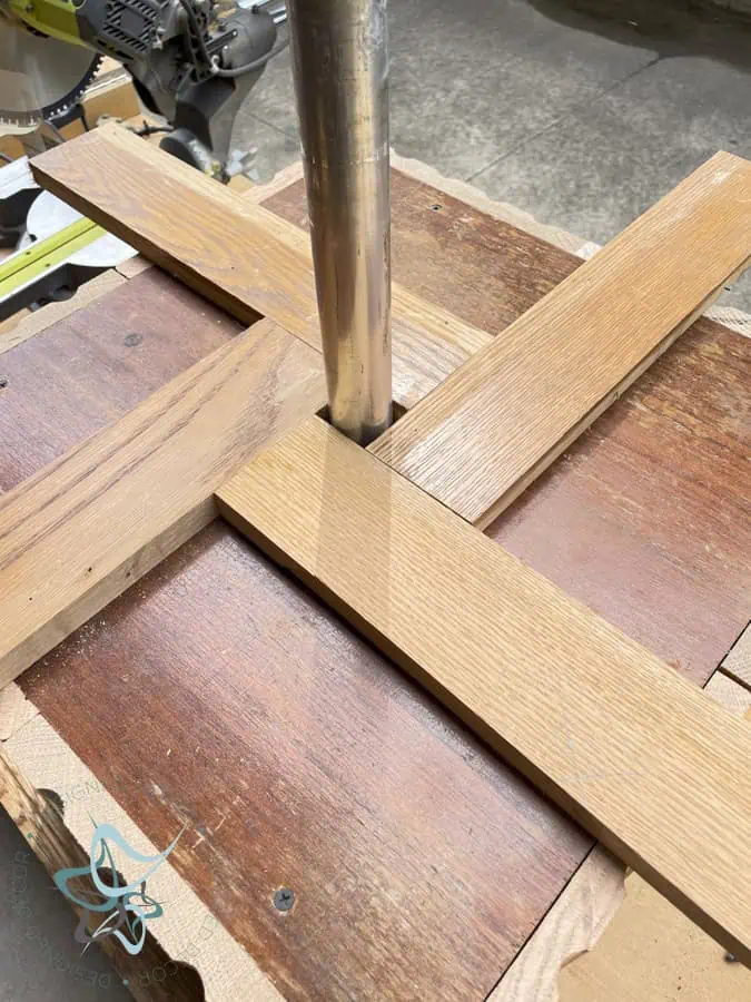 oak wood pieces sitting on top of umbrella side table