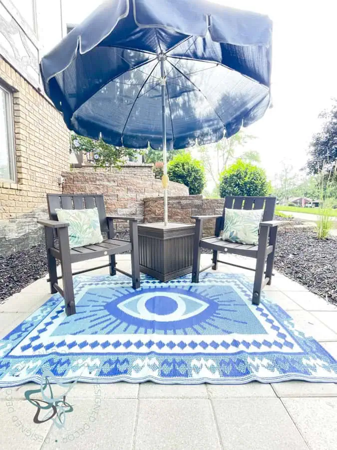 outdoor seating area with diy umbrella table and 2 side chairs