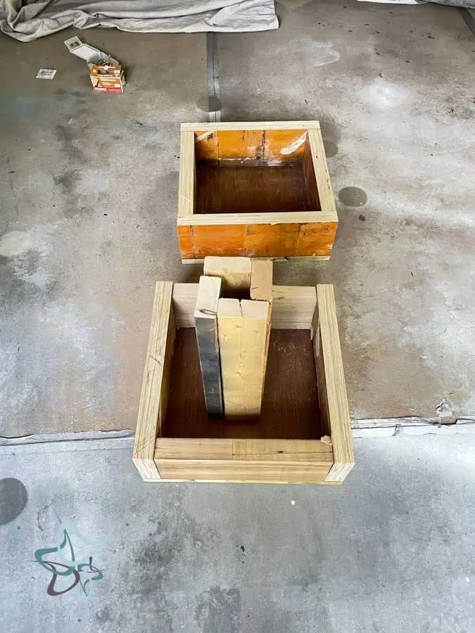 wood beam cut to size and assembled to form 2 boxes