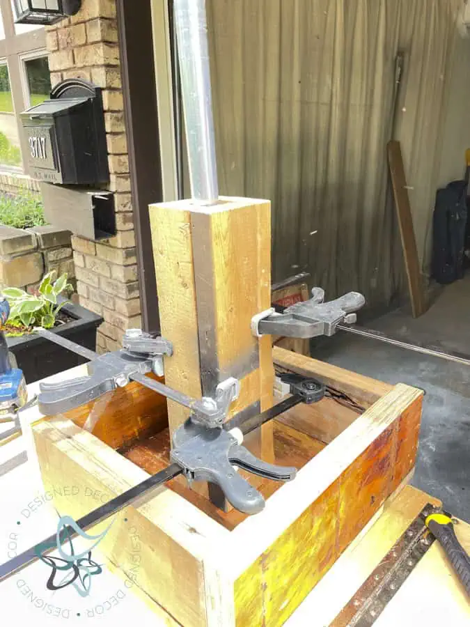 cut wood clamped together using vice clamps