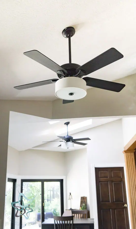 updated ceiling fan painted black with a drum shade light kit